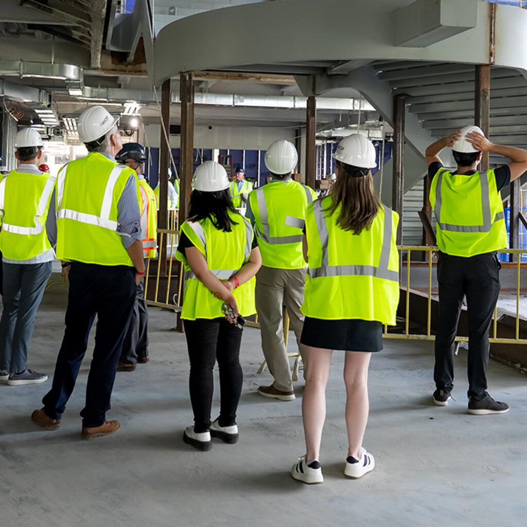 People touring a modern construction site