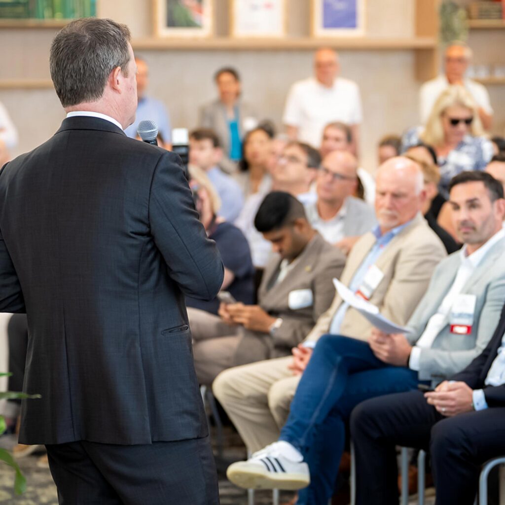 Person giving a talk at a conference